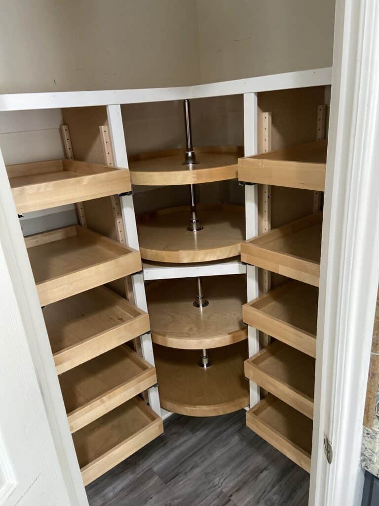 Custom pantry cabinet with organized wood shelving by JB Shelving